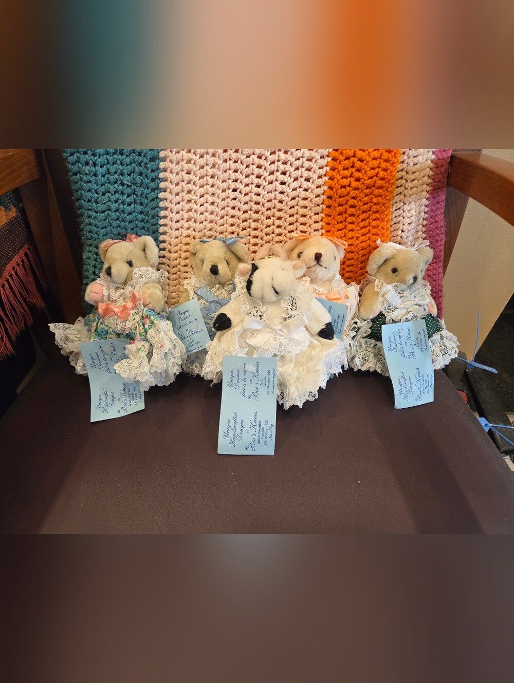 Vintage, jointed plush teddy bears dressed in Victorian-style lace dresses